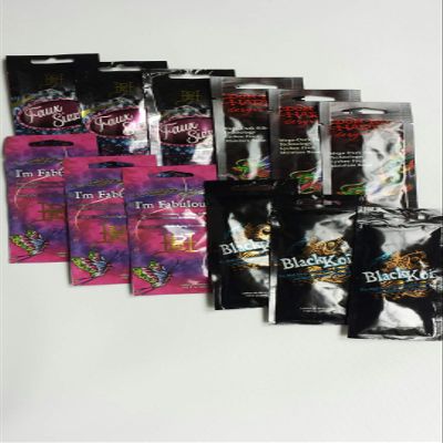 12 Tanning Packets from Ed Hardy, 3 Black Koi, 3 I'm Fabulous, 3 Diving Dragons, 3 Fau Sizzle