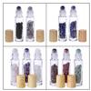 10Pcs 10ml Natural Semiprecious Stones Essential Oil Roller Bottles Clear Glass Roll-on Bottles Gemstone with Wooden Caps and Healing Crystal Chips Inside view 3