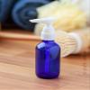 2 oz / 60 ml Cobalt Glass Boston Round Bottle with White Lotion Pump (12 Pack) view 3