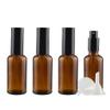 DLIBUY 4 Pcs Empty 50ml Brown Glass Fine Mist Pump Spray Bottles with Black Alu Pump Head, Amber Travel Portable Small Refillable Sprayer Bottles for Cosmetic Perfume Water, with 1x Funnel view 1