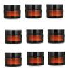 Healthcom 20 Packs 5g/5ml Empty Amber Glass Cream Jar Pot Bottle Cosmetic Cream Lotion Bottle Vials with Black Lids Refillable Glass Jar Makeup Sample Container for Lotion Creams Salve Lip Balms view 1