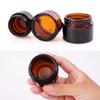 Healthcom 20 Packs 5g/5ml Empty Amber Glass Cream Jar Pot Bottle Cosmetic Cream Lotion Bottle Vials with Black Lids Refillable Glass Jar Makeup Sample Container for Lotion Creams Salve Lip Balms view 3