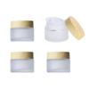 4Pack 50g Frosted Glass Cosmetic Jars, Empty Sample Containers with Wood Grain Lids for Lotion, Lip Balm, Eye Cream, Scrubs, Oils, Salves, Ointments (White) view 1