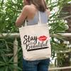 12oz Canvas Tote Bag - Stay Beautiful with Red Lips & Eyeliner Design - Beauty Themed Merch for Makeup Artist or Cosmetologist, Gift for Makeup Lovers & Beauticians view 2
