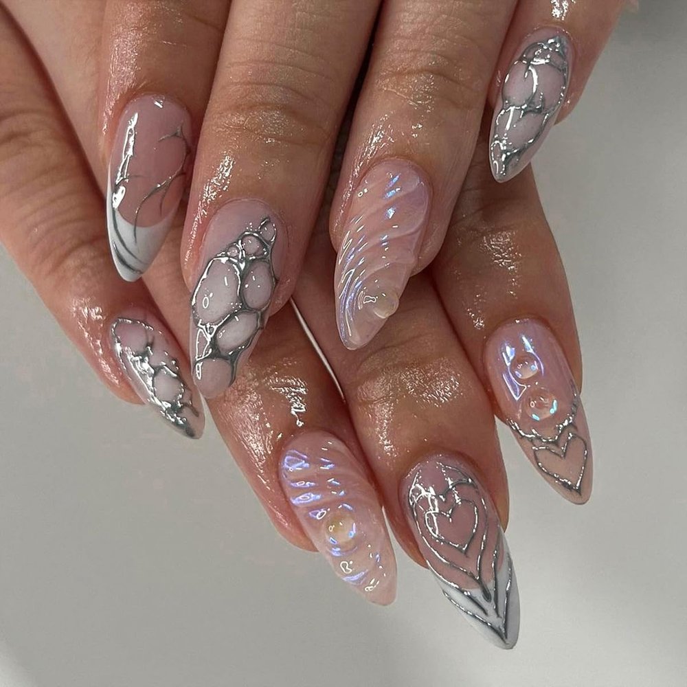 24 Pcs Almond Press on Nails Medium Nude Full Cover Stick on with Silvery Glitter Designs Acrylic Glossy False 3D Water Ripple Charms French for Women Girls