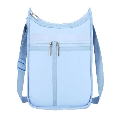 LeSportsac Blue Iris Deluxe Everyday Crossbody Bag + Cosmetic Bag, Style 7507/Color R133, Fashion Trending Cool Coastal Sky French Blue, Tranquil New Neutral, Subtle Sheen, Recycled Collection