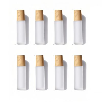 Doromy 8Packs 10ml Refillable Glass Roller Bottles Frosted Comestic Container with Wooden Caps Essential Oil Roll On Portable Roller Bottles with Stainless Steel Roller Balls for Travel Home use