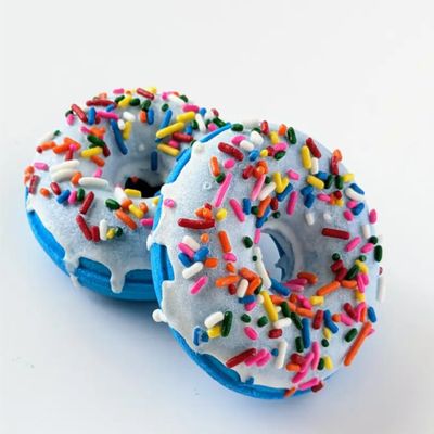 Decorative Bath Bomb, White Frosted Donut Shape with Rainbow Sprinkles, Blue Base.