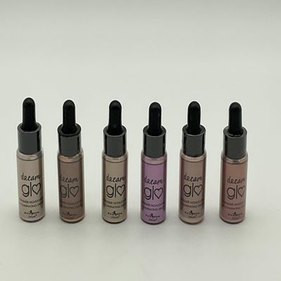 Dream Gl Shimmer Highlighter and Illuminating Drops Set, 6 Pieces 1 each Glo Digger, Glo to Havana,Glo Faced, Glo Glo Girl, Glo Goddess, Glomazing. Bottles are glass and about 1 ounce each.