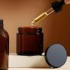 2oz Jars with Lids, HOA Kinh 40 Pack Amber Glass Jars with Lids Empty Cosmetic Containers Round Airtight Glass Jar with Black Lid for Storing Lotions Powders Ointments view 4