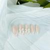 BQZQPAMZ 24pcs Press On Nails Medium Almond With 3D White Bow Rhinestone Design Pearl Gem French Tip Fake Nails Acrylic Artificial Fingernails for Women Nail Art Supplies view 3
