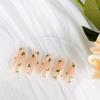 BQZQPAMZ 24pcs Nude Almond False Nails Spring Flowers Press on Nails Medium with Glue Green Leaves Design Stick on Nails Full Coverage Acrylic Nails Women Nail Art Supplies view 3
