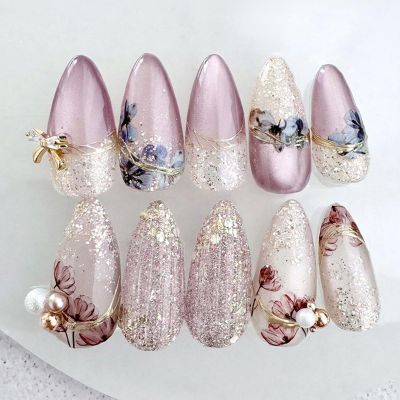 24pcs Purple Flower Press On Nails Medium Almond Fake Nails with 3D Pearl White Glitter Design Gold Bow Rhinestone False Nails Full Cover Acrylic Artificial Nails for Women DIY Spring Manicure