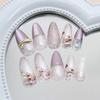 24pcs Purple Flower Press On Nails Medium Almond Fake Nails with 3D Pearl White Glitter Design Gold Bow Rhinestone False Nails Full Cover Acrylic Artificial Nails for Women DIY Spring Manicure view 3