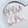 24pcs Purple Flower Press On Nails Medium Almond Fake Nails with 3D Pearl White Glitter Design Gold Bow Rhinestone False Nails Full Cover Acrylic Artificial Nails for Women DIY Spring Manicure view 4