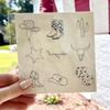 1 sheet, 9 unique tattoos. Pages are 5 x 5, Tattoos range in size from 1 - 2 Minimalist themed temporary tattoos. view 2