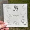 1 sheet, 9 unique tattoos. Pages are 5 x 5, Tattoos range in size from 1 - 2 Minimalist themed temporary tattoos. view 3