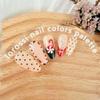 24Pcs Christmas French Tip Press on Nails Medium Almond Cute Candy Canes Fake Nails Red Green White Glue on Nails Glossy Acrylic Nails for Women New Years Manicure Gift Nail Decoration view 4