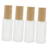 4Pcs Refillable Glass Lotion Bottles, Frosted Wood Grain Travel Dispenser view 1
