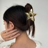 Concave and convex hollow five pointed star metal grip clip, cool and high-end, big star shark clip on the back of the head view 3