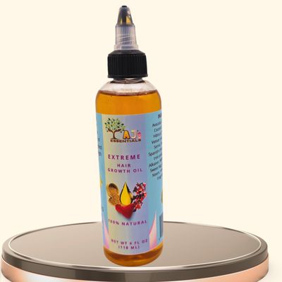 AJ's Extreme Hair Growth Oil Infused with biotin, fenugreek, and avocado oil to moisturize, repair split ends, and support longer, healthier hair