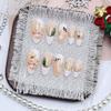 24Pcs Christmas France Tip Press on Nails Medium Almond Snowflake Snowman Xmas Tree Fake Nails Gold Star Glue on Nails Winter Full Cover Acrylic Nails for Women Christmas Nail Decoration view 3